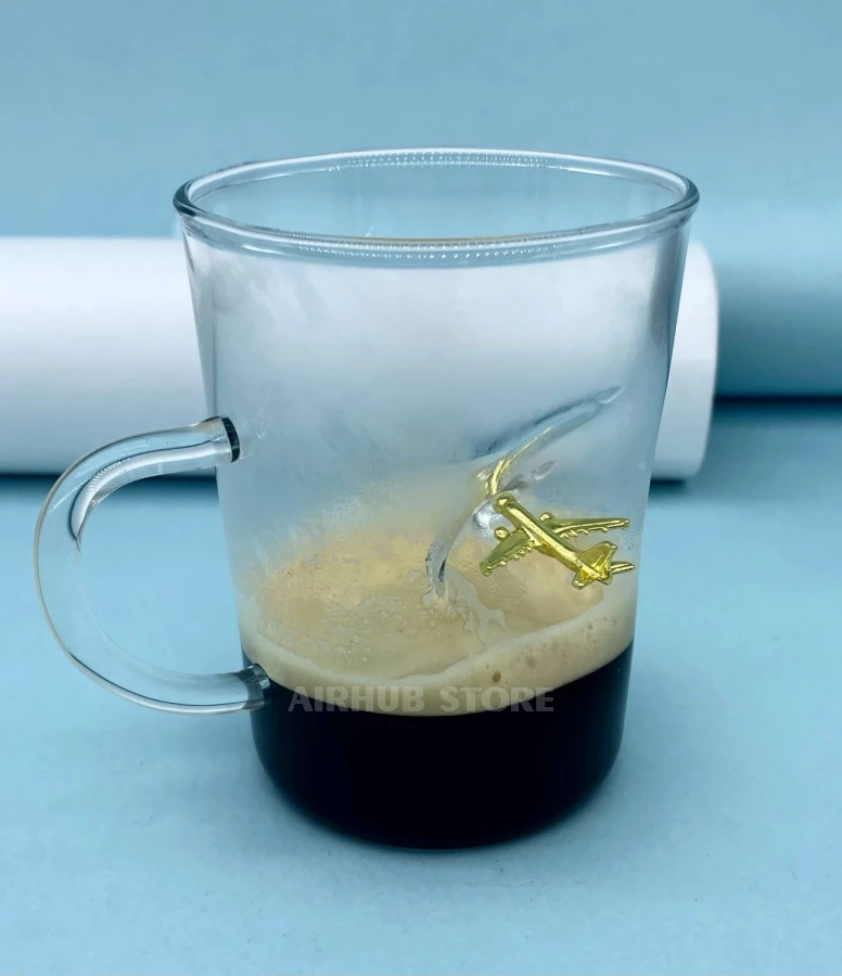 Glass coffee cup with an airplane