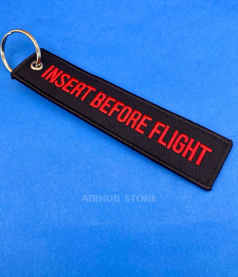 Insert Before Flight Keychain
