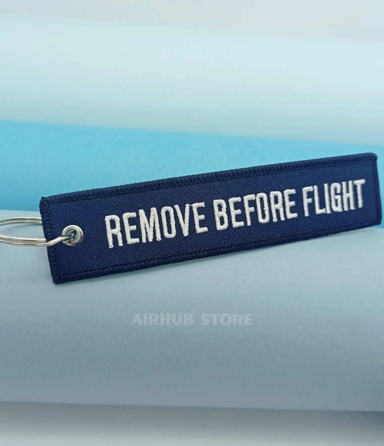 Remove Before Flight blue Keychain