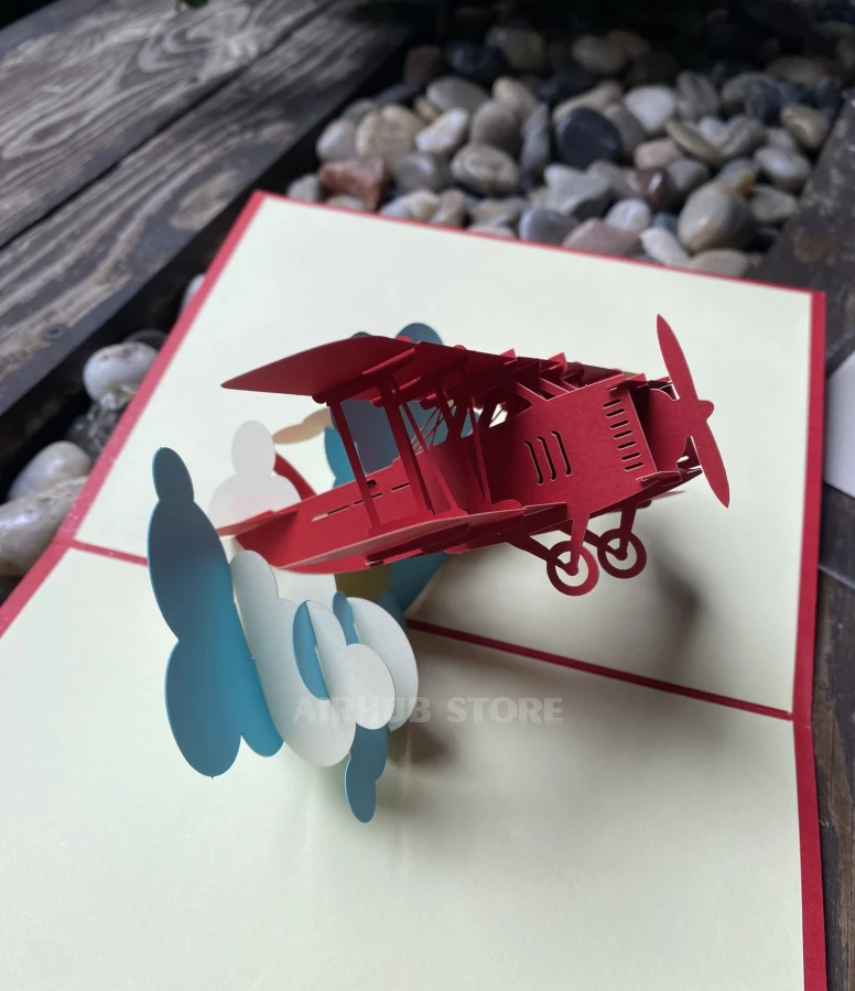 Postcard biplane with clouds